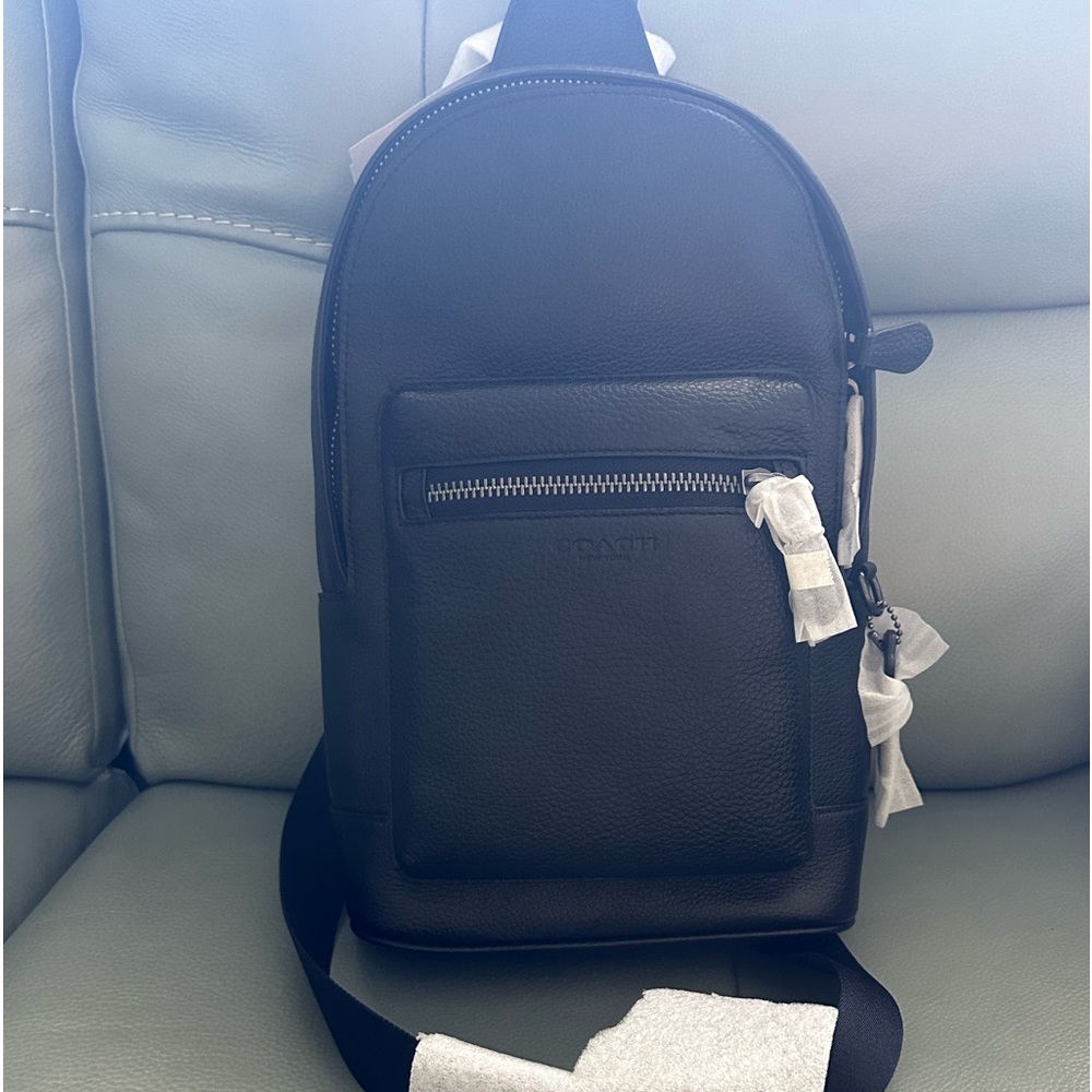 Men coach sling bag  new!!! Never used it . Reg 169. Asking 140. OBO Jax. Fl